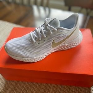 Nike Revolution 5 white with gold swoosh